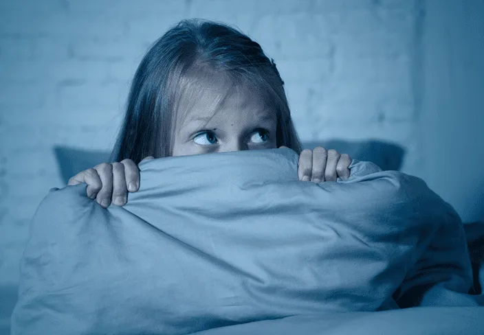 girl under a blanket